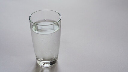 woman dissolves effervescent tablet