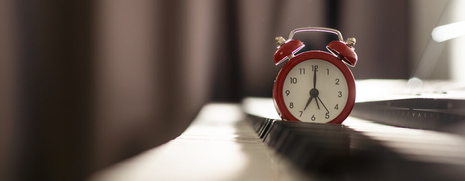 alarm clock on piano, synthesizer
