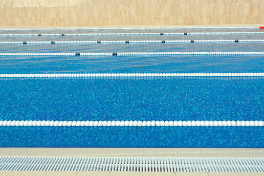 Lanes Of A Competition Swimming Pool Outdoors Empty, No People.