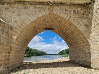 Fototapeta na wymiar View of an eye of the Roman bridge of Tordesillas with the Duero river - Spain