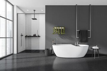 Front view on dark bathroom interior with bathtub, shower, stool