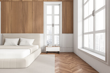Stylish bedroom interior with bed and nightstand, panoramic window