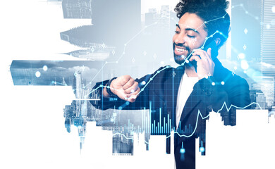 Smiling middle eastern businessman looking at his watch, talking on smartphone. Double exposure forex hologram with lines and candlesticks, skyscrapers. Concept of online trading