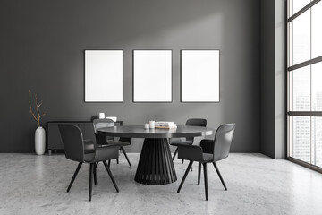 Dark dining room interior with dining table, three empty poster