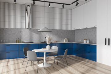 Cozy kitchen interior with dining table and kitchenware with decoration