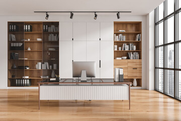 Light office interior with work desk and cabinet near panoramic window - obrazy, fototapety, plakaty