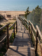 wooden walkway on the beach of sabaudia at circeo latina