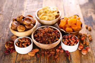 assorted of dried fruits on wood background