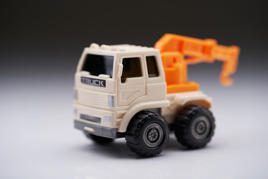 close up of tow truck against gray background