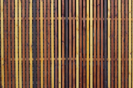 background cute multicolored wooden vertical fence rails.