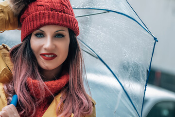 girl with umbrella raining on the street