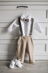 Boy suit fashion background. Little man dressing up. Infant baptism ceremony preparation. Newborn...