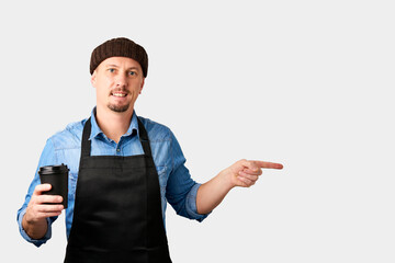 Young man barista portrait on white background with copy space