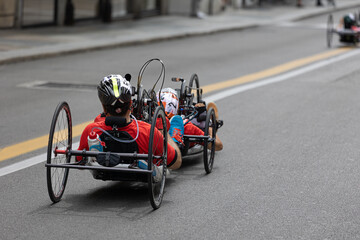 Couple of Athletes training with Their Special  Bikes on a City Track