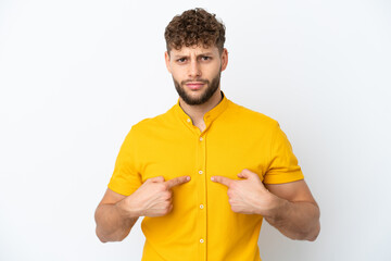 Young handsome caucasian man isolated on white background pointing to oneself