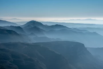 Crédence de cuisine en verre imprimé Été Mountain landscape with misty weather and blue sky
