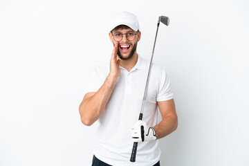 Handsome young man playing golf  isolated on white background with surprise and shocked facial expression