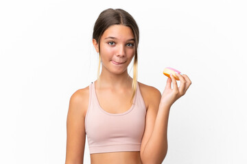 Little caucasian girl isolated on white background holding a donut