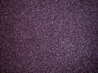 Purple glitter sparkling light background.