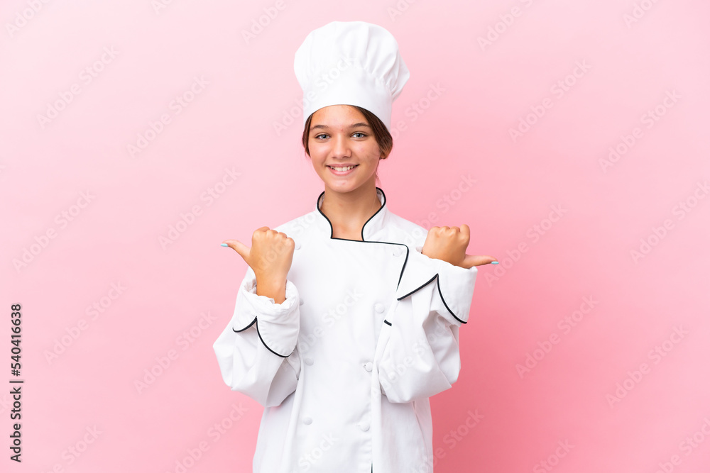 Sticker Little caucasian chef girl isolated on pink background with thumbs up gesture and smiling