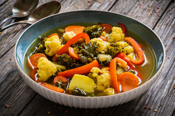 Vegetable soup on wooden table