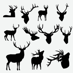 Naklejka premium Black silhouettes of wild deer vector illustration