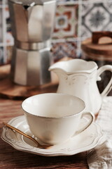 Coffee cup mockup and kitchen utensils table Portuguese and Spain Azulejo tile background,trendy Eco style home still life. Space for text or menu . Business food brand template. 