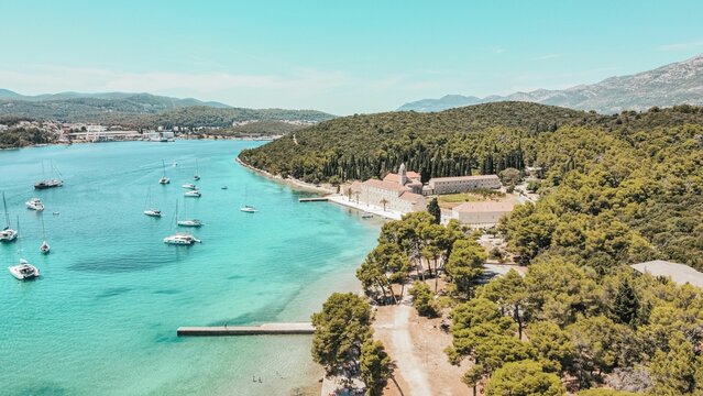 Drone shot of charming Badija island coast and turquoise water, Croatia