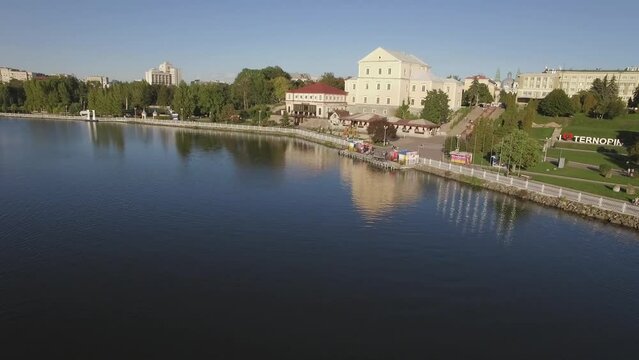 Aerial view of Ternopil waterfront Columns on the shore of the lake in sunny day