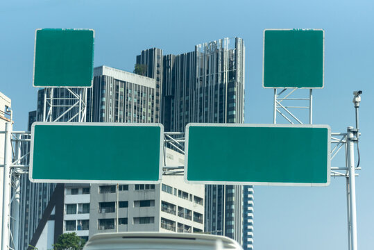 Green expressway sign with space for text.
