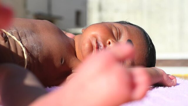 New Born Baby Laying On Direct Sunlight. Benefits of increased Vitamin D, Serotonin Levels, Insulin Levels, Manages Jaundice, and Higher Energy Levels.