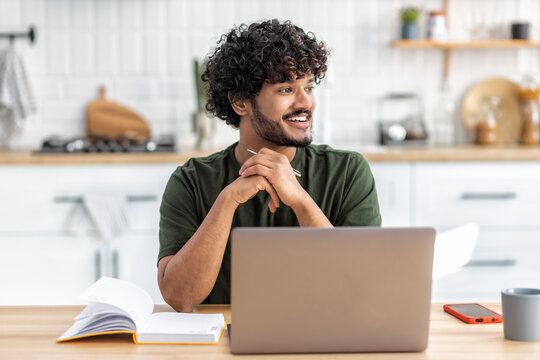 Distance Learning. Portrait Of Smiling Young Asian Male Freelancer Or Student Sitting At Home Using Laptop Computer For Online Education