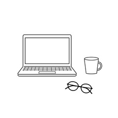 パソコンとめがねとカップ