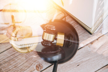 Business and lawyers discussing contract papers with brass scale on desk in office. Law, legal services, advice, justice and law concept picture with film grain effect