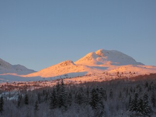 Fototapeta na wymiar Sunset at Gaustatoppen in winter in Tuddal, Norway