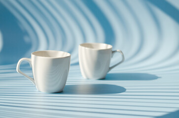 Cups of hot black coffee, tea on blue background. Top view, copy space, mockup. Flat lay. Modern breakfast food.