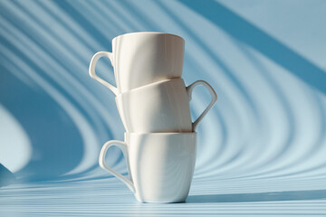Cups of hot black coffee, tea on blue background. Top view, copy space, mockup. Flat lay. Modern breakfast food.