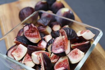 juicy fresh figs on a wooden cutting board
