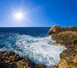 rocky coast stormy sea bay at sunny day