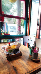 Close up of cheeseburger with french fries on a cafe table 