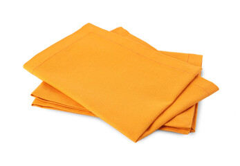 Naklejka premium New clean orange cloth napkins isolated on white