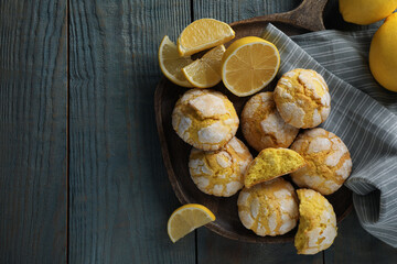 Board with delicious lemon cookies on light blue wooden table, flat lay. Space for text