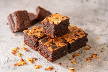 Thick brownies, topping with slash almond as popular dessert in cafeteria