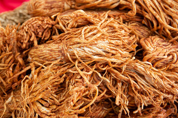 Golden-colored smoked cheese straws with spices and red pepper. Close-up. Selective focus.