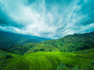 Beautiful landscape mountain green field grass meadow white cloud blue sky on sunny day. Majestic green scenery big mountain hill cloudscape valley panorama view in countryside greenery pasture