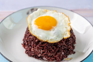 Fried egg served with riceberry.