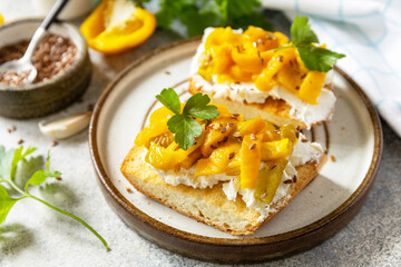 Open sandwiches set with grill bulgarian pepper and cream cheese philadelphia on a stone table. Healthy food, vegetarian appetizer.