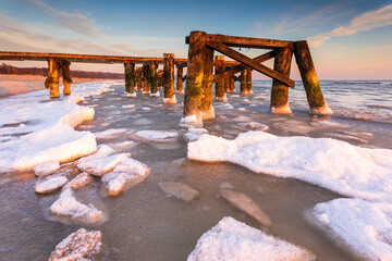 Early morning at frozen small pier in Sopot. Poland.