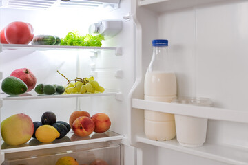 open fridge with fresh fruits and vegetables. refrigerator with healthy food.Healthy food...