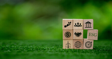 ESG concept of environmental, social and governance. words ESG on a wood cube is an idea for...